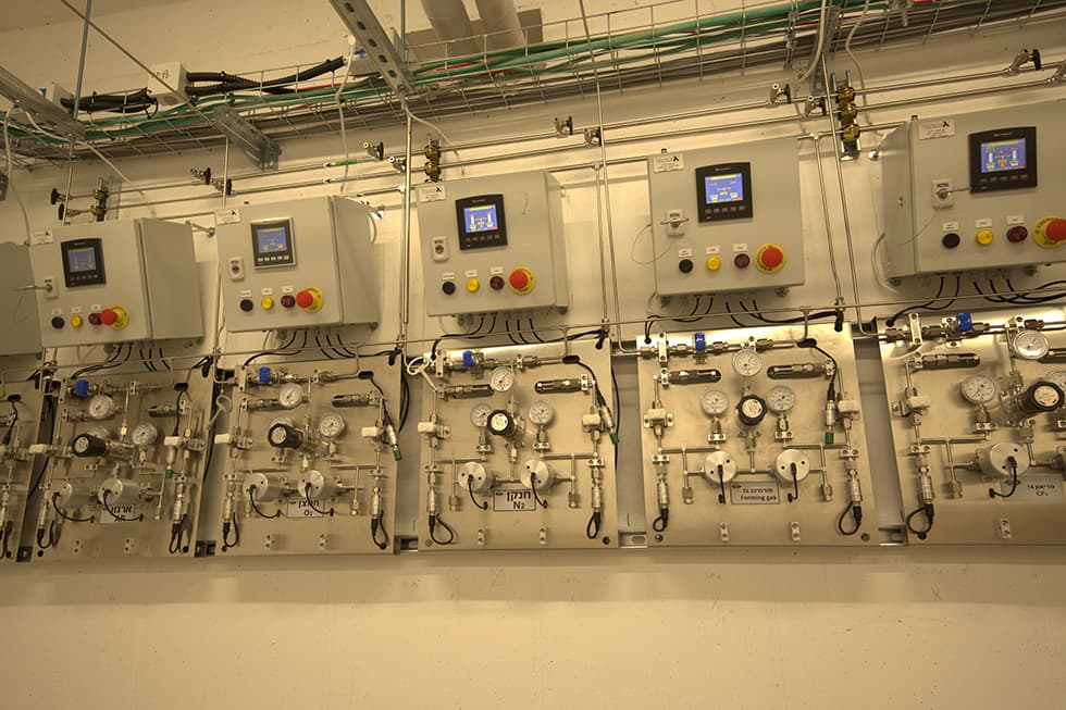 Five stainless gas panels with control cabinets and touch screens