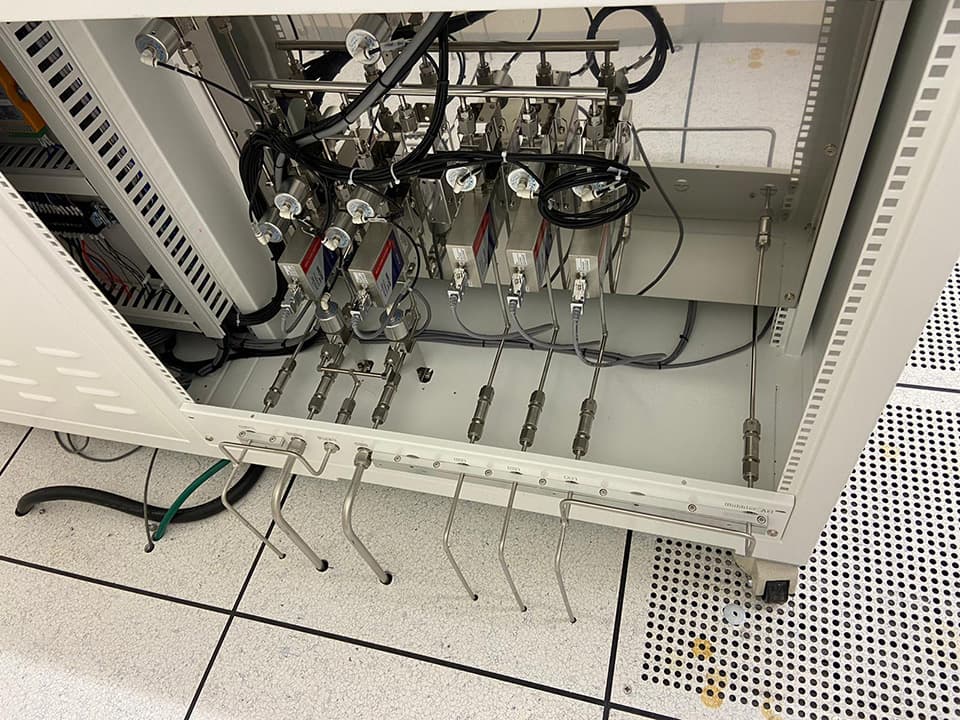 Open cabinet with regulators and coiled tubing