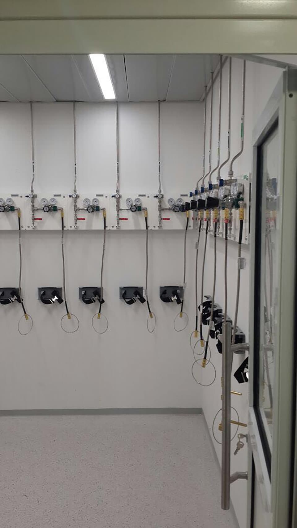 Corridor with wall-mounted point-of-use valves