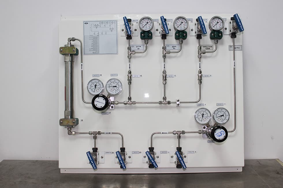 Panel with four flow meters, pressure gauges and ball valves
