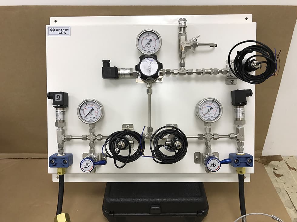 A clean dry air panel in the workshop, with pressure transmitters and wiring