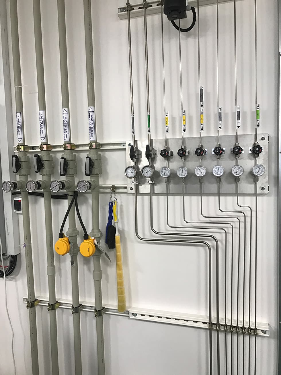 Wall header with pressure gauges and drops to points of use