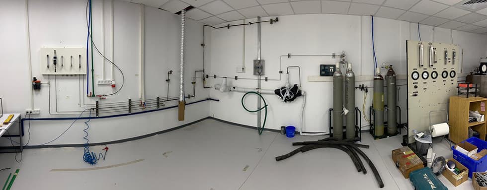 Gas room with cylinders and floor-run lines