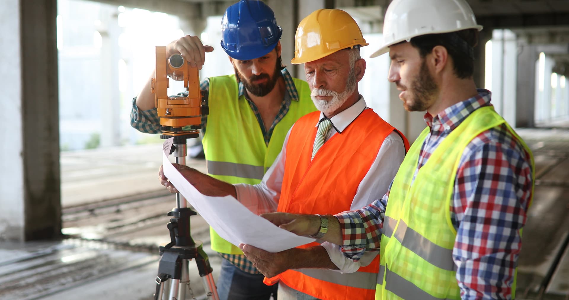Engineering team reviewing plans on a construction site
